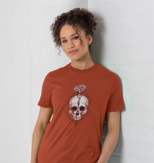 Burnt orange t-shirt with skull and flower design (person)