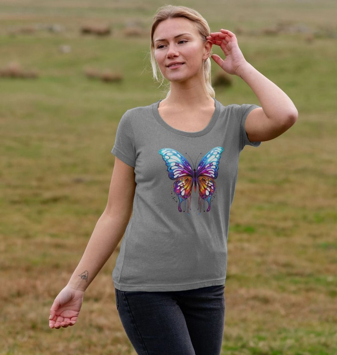 Gray t-shirt with colorful butterfly design (person)