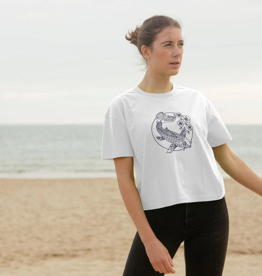 White t-shirt with koi fish design (person)