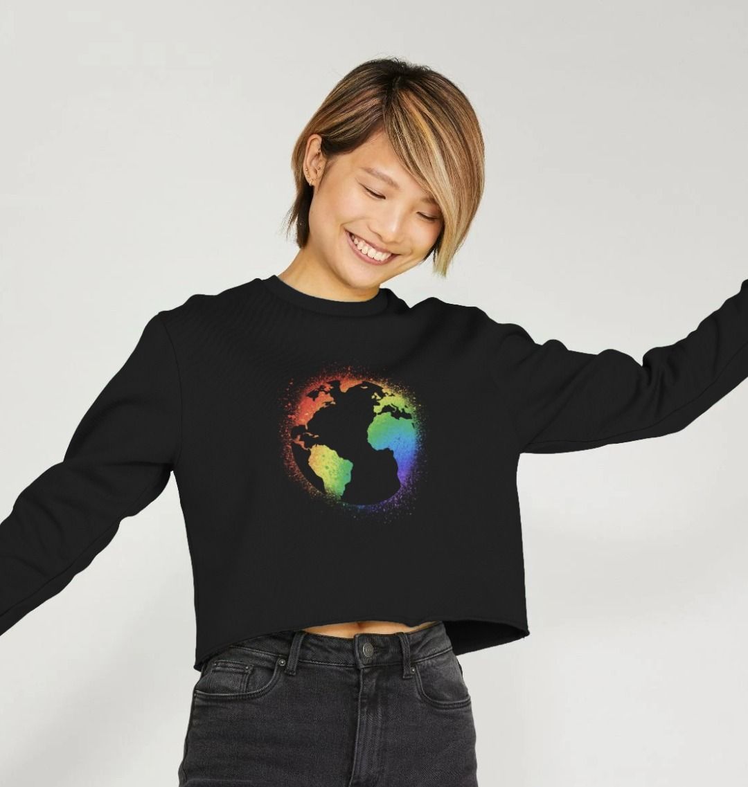 Black cropped sweatshirt with rainbow globe design (person)