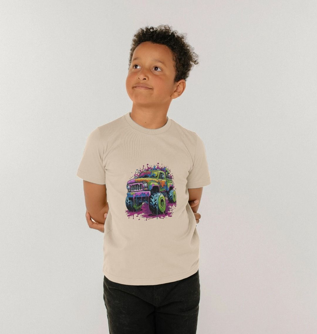 Beige t-shirt with colorful monster truck graphic (person)