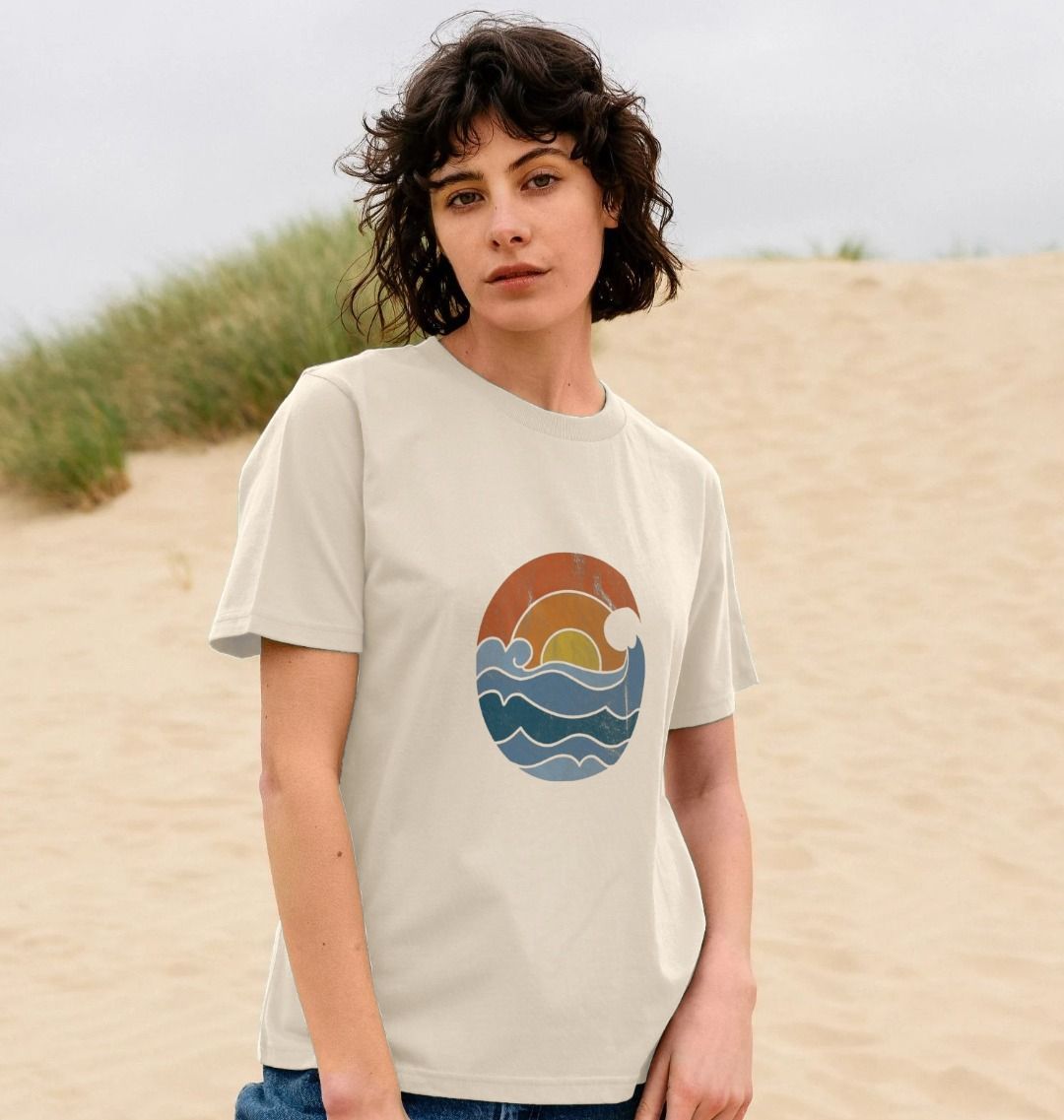 Beige t-shirt with ocean wave graphic (person)