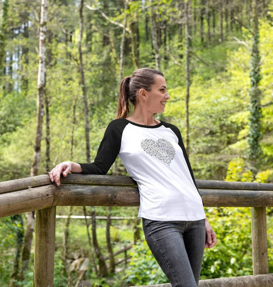 Black and white raglan t-shirt with heart design (person)