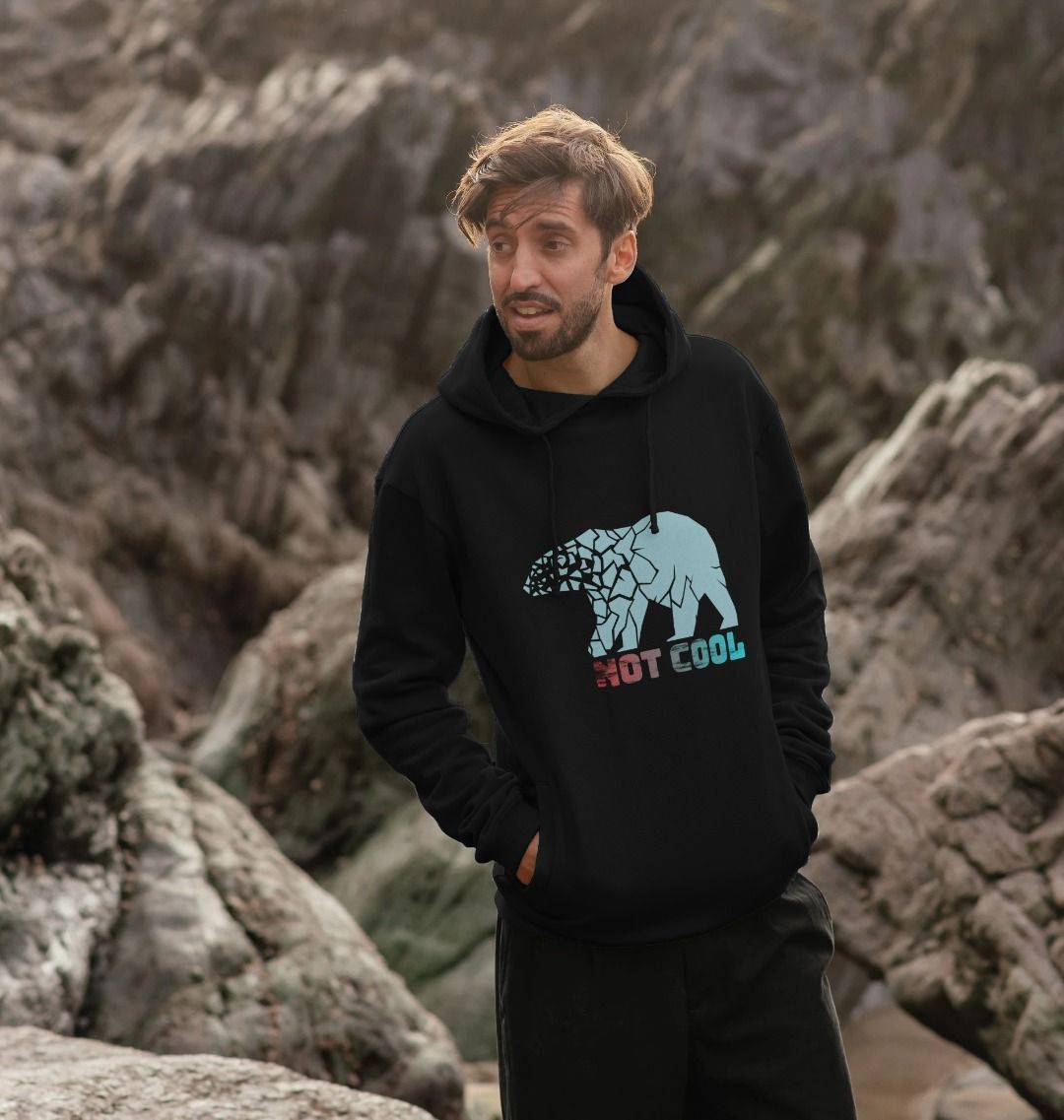 Black hoodie with "NOT COOL" and bear graphic (person)