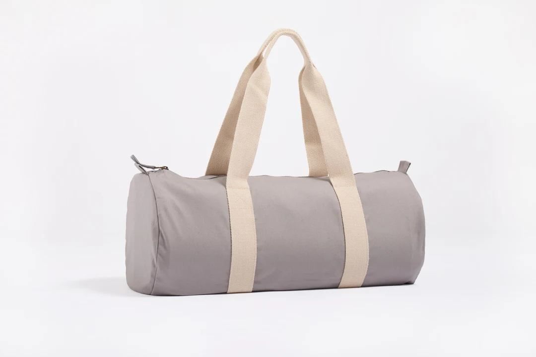 Gray cylindrical duffel bag with beige handles