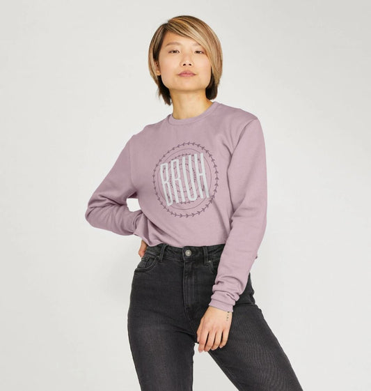 Purple sweatshirt with "BRUH" graphic (person)