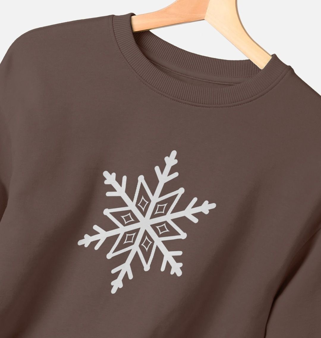Brown sweatshirt with white snowflake design