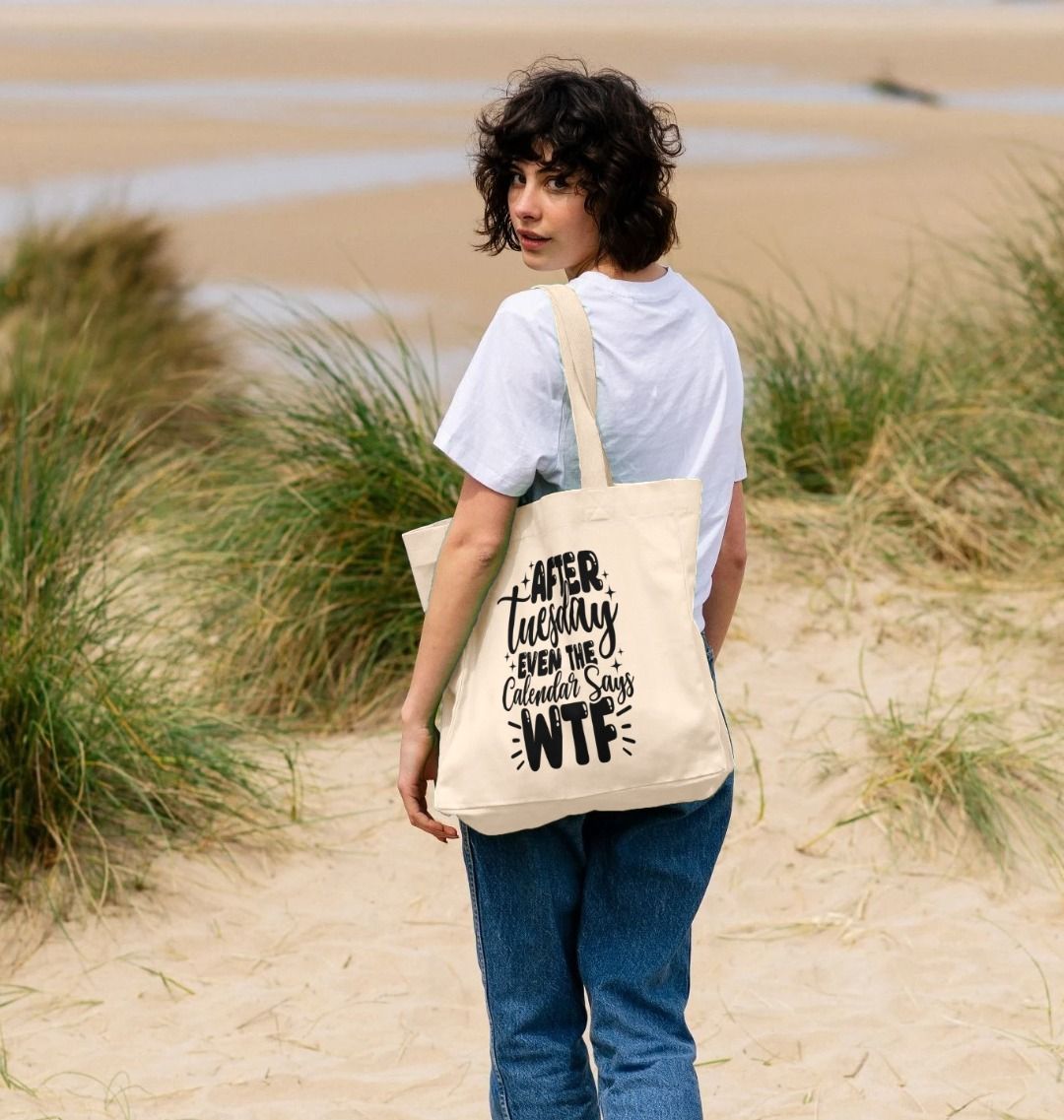 Natural canvas tote bag with "After Tuesday Even the Calendar Says WTF" text (person)