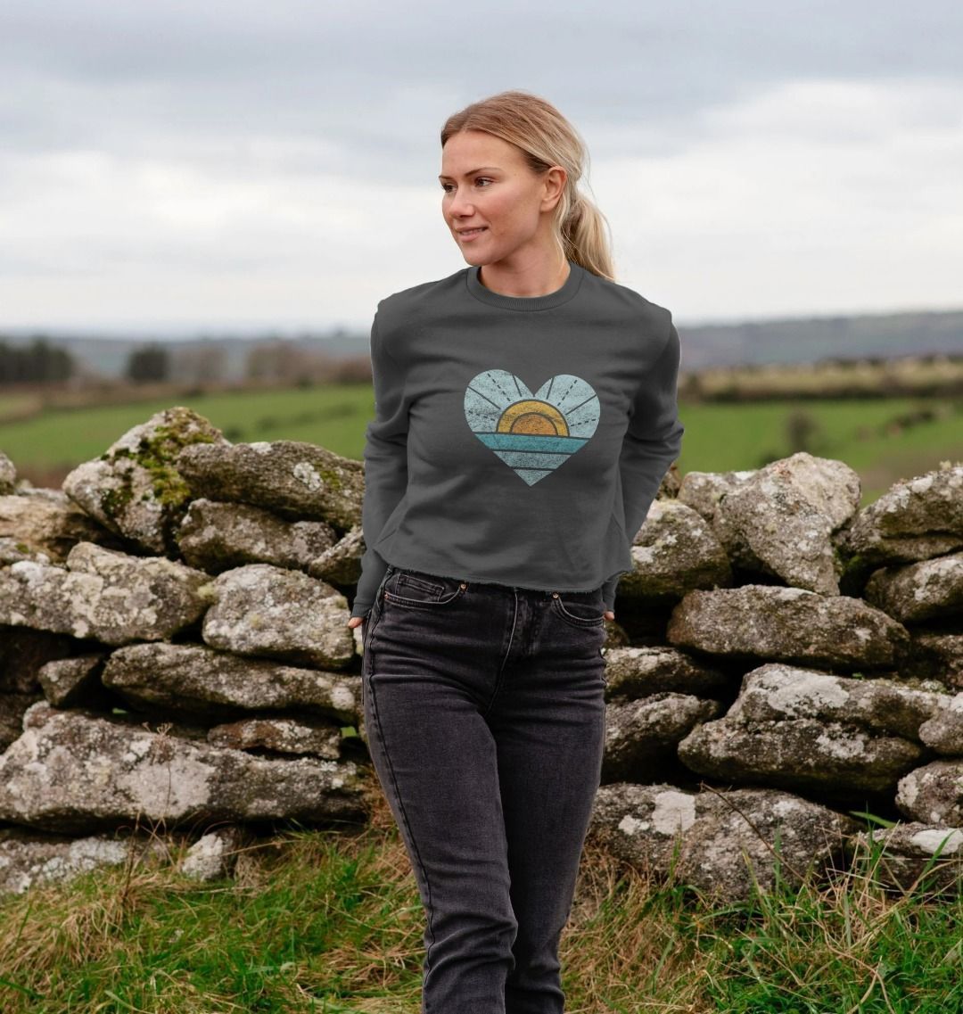 Grey long-sleeved sweatshirt with heart design (person)