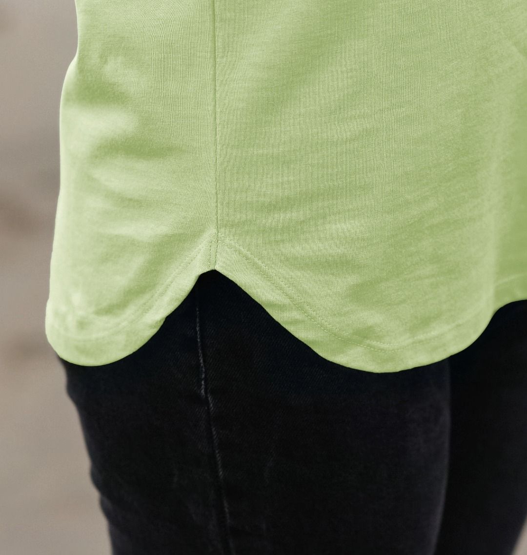 Lime green t-shirt with black pants (person)
