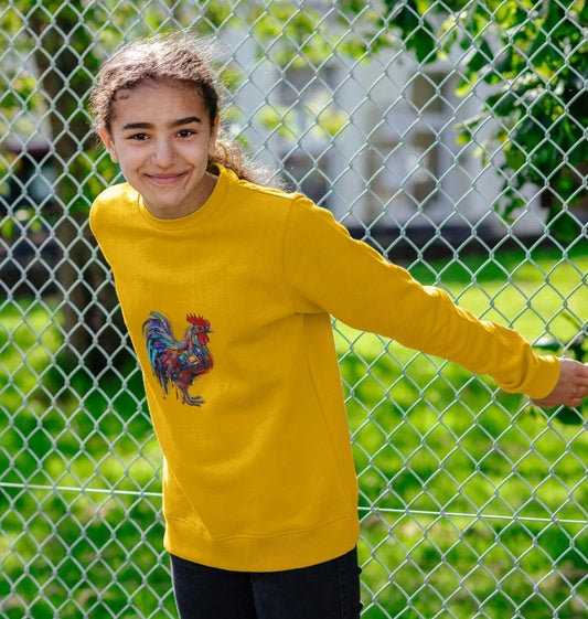 Yellow sweatshirt with rooster graphic (person)
