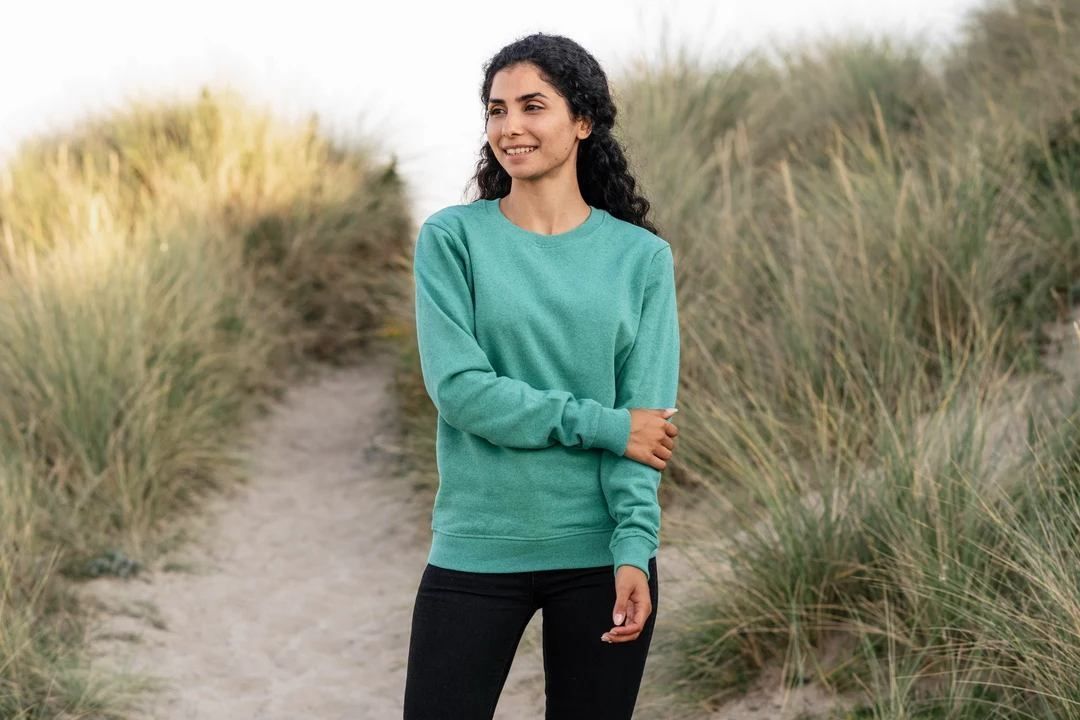 Teal green crewneck sweater (person)