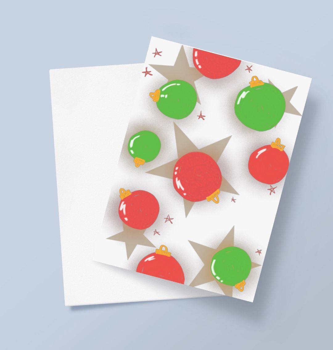 Christmas ornaments and stars on white card