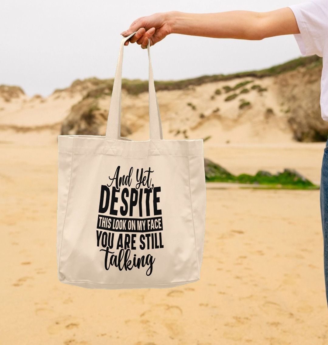 White tote bag with text design (person)