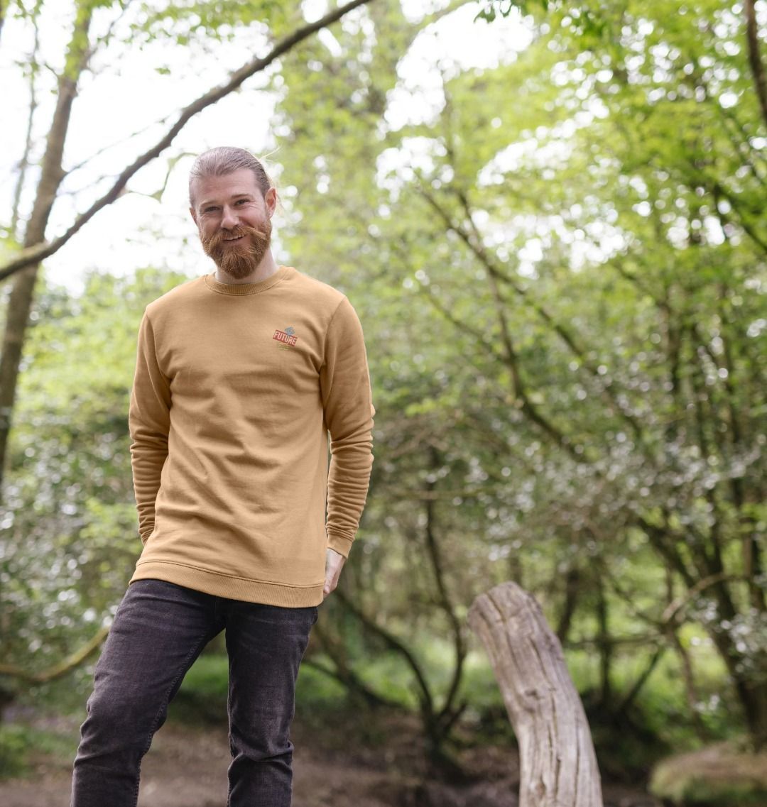 Camel-colored long-sleeve sweatshirt with "FUTURE" logo (person)