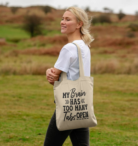 Canvas tote bag with text "My Brain Has Too Many Tabs Open" (person)