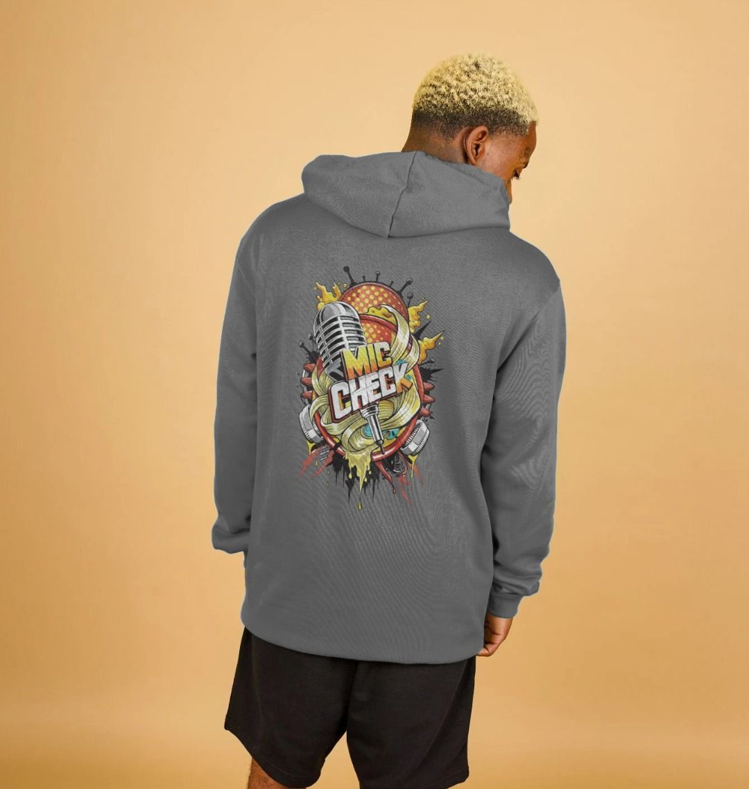 Gray hoodie with "MIC CHECK" graphic (person)