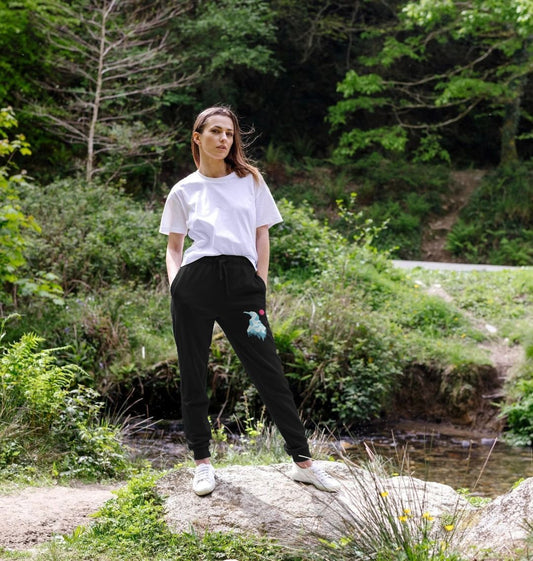 Black sweatpants with bird design (person)