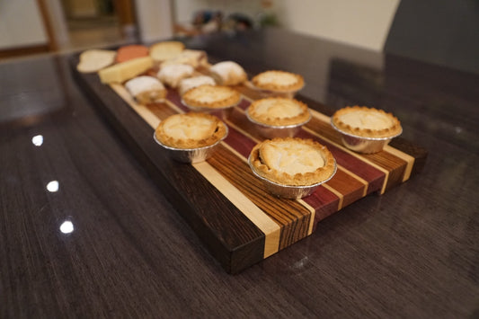 Mini pie tins on wooden board